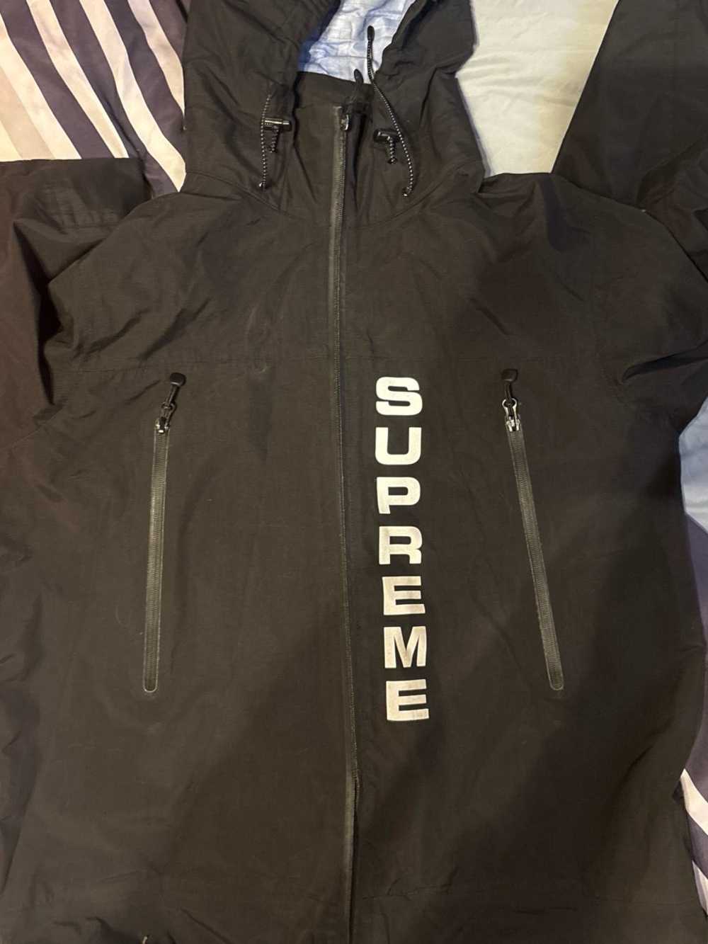 Supreme Black Hooded Raincoat with Vertical White Logo